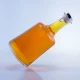 097-custom shape wide bottom long neck transparent glass bottle