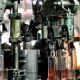 What is the difference between manual and assembly line glass bottles?